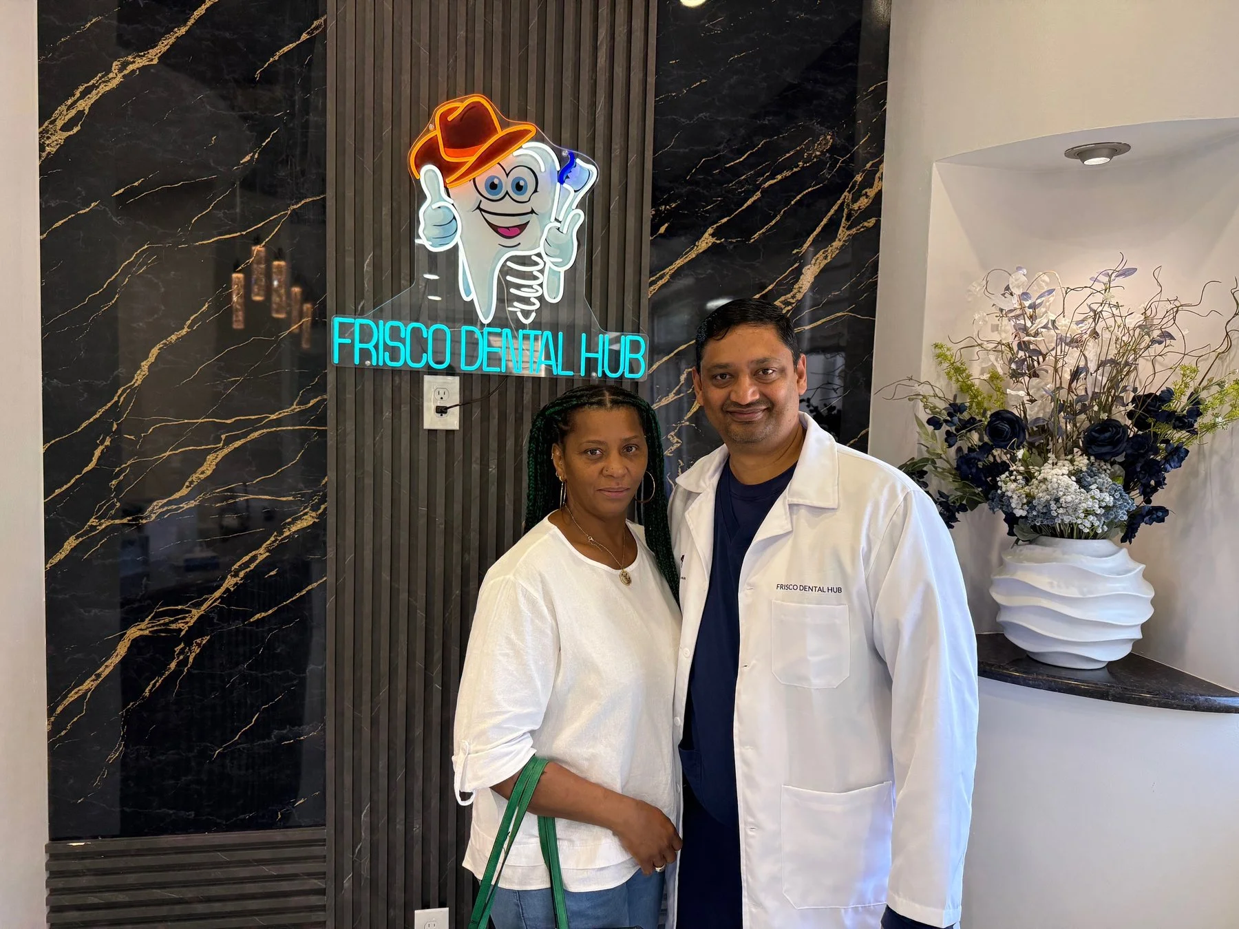 Dr. Chakrapani Nannapaneni DDS with patient at Frisco Dental Hub — compassionate same-day emergency dental care in Frisco TX 75035 serving Plano McKinney and North Texas