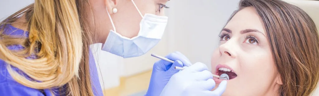 Dentist providing same-day emergency dental care to a patient at Frisco Dental Hub, 4500 Hillcrest Rd Suite 190, Frisco TX 75035 — emergency dentist serving Plano, McKinney, Prosper and North Texas