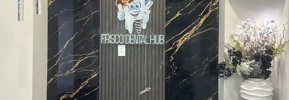Frisco Dental Hub reception — modern dental office with neon logo on black marble wall at 4500 Hillcrest Rd Suite 190 Frisco TX 75035 — emergency dentist serving Plano McKinney Prosper TX